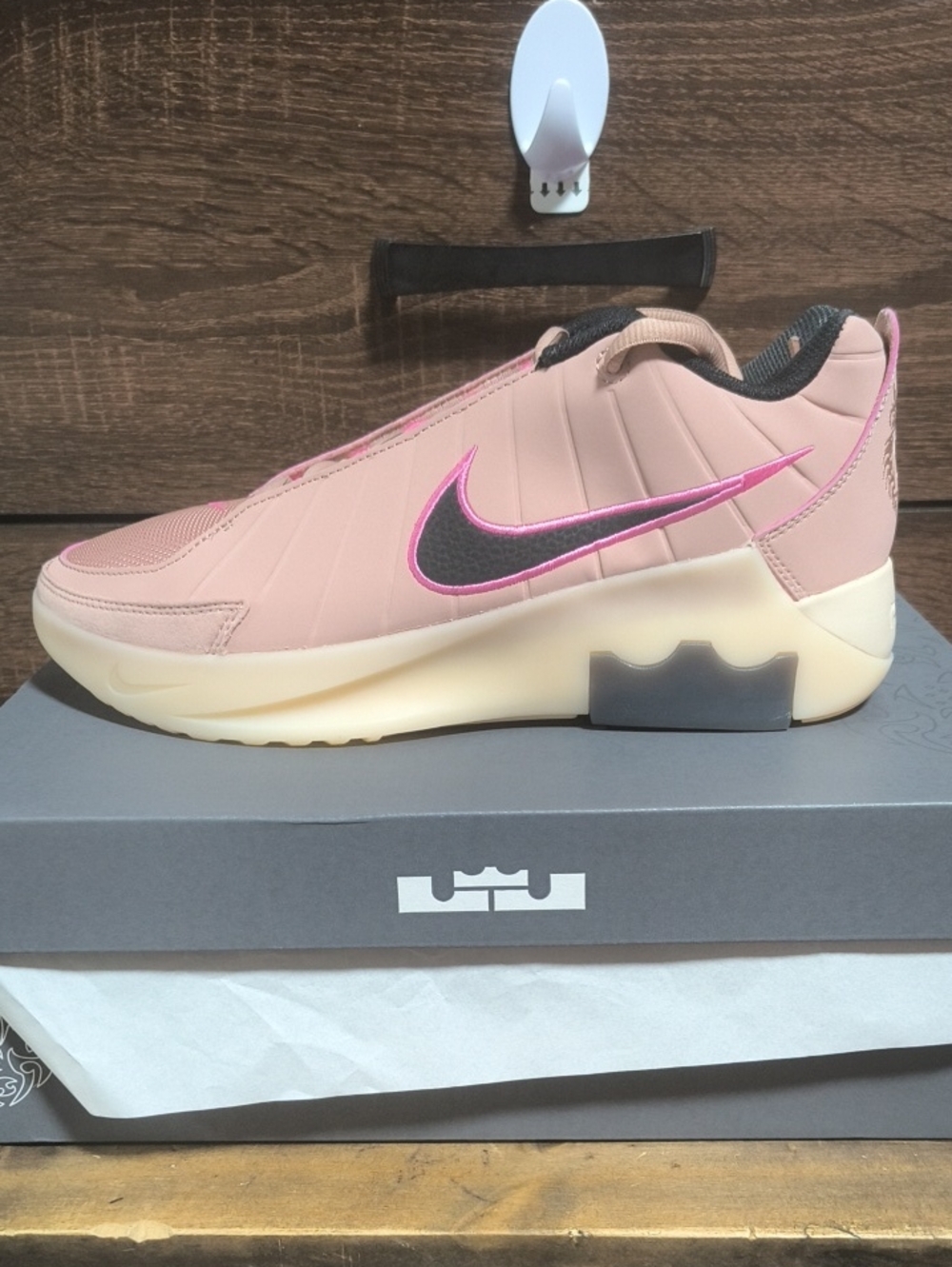 Nike Women’s Pink Slip-On Sneakers with Black and Metallic Pink Swoosh